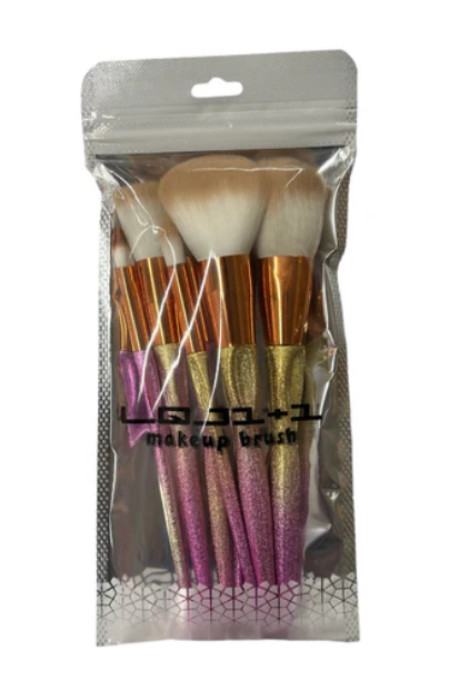 Makeup Brush Set - 7 pieces in gold and pink."