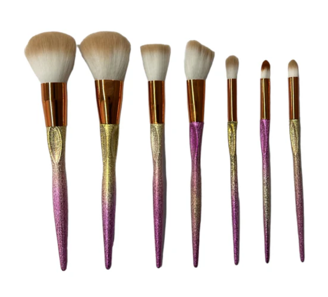 Makeup Brush Set - 7 pieces in gold and pink."